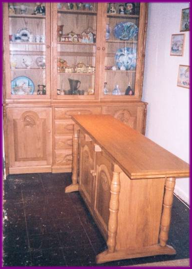 An carved oak dresser and table I made .The table opens out to seat 6 with the settle in, in the picture below,  on one side 